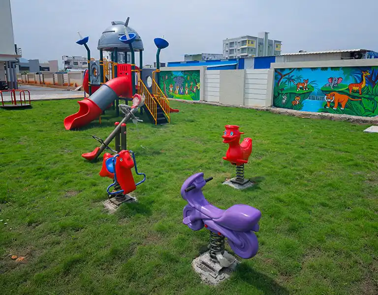 Colourful outdoor play area at Balaji HighFields